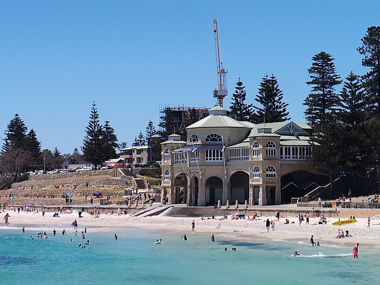 The west facing sand of Cottesloe Beach in Perth glowing as the sun drops over the Indian Ocean