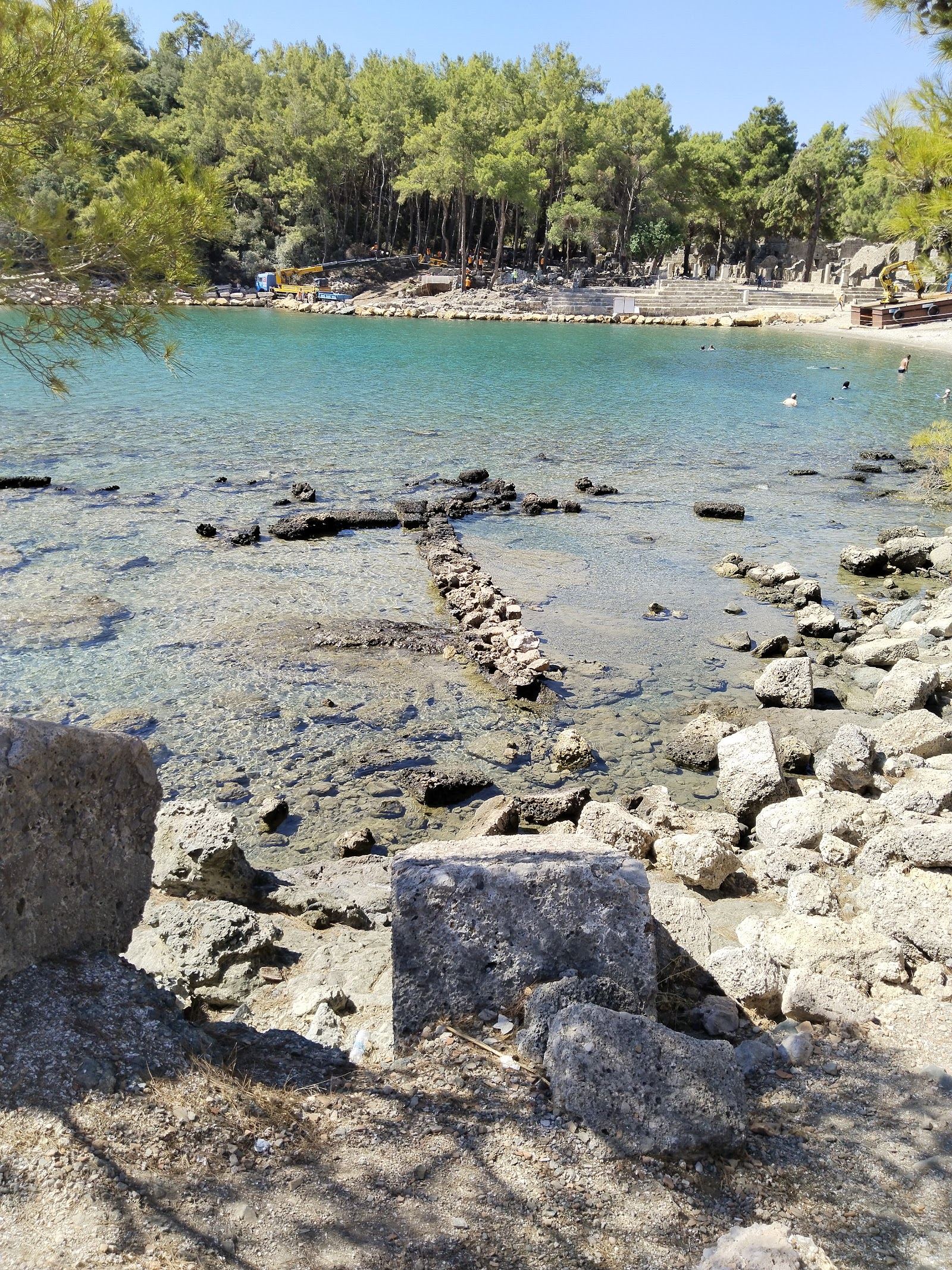 Calm clear water and ancient ruins beside one of the three bays at Phaselis near Antalya