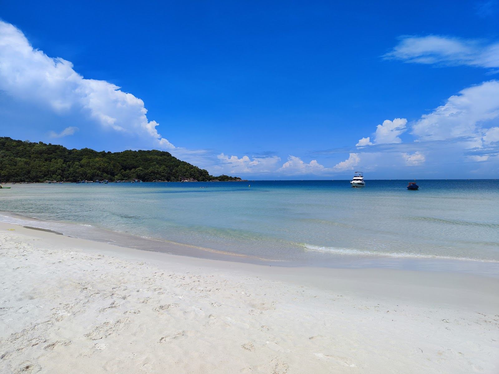 Glassy calm shallow water over pale sand at a sheltered bay on Phu Quoc