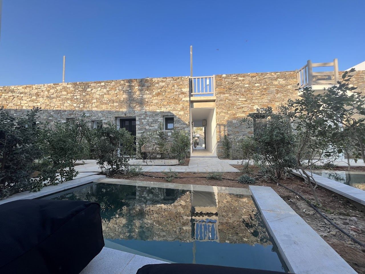 The working harbour and sheltered sandy beach of Piso Livadi village on the east coast of Paros