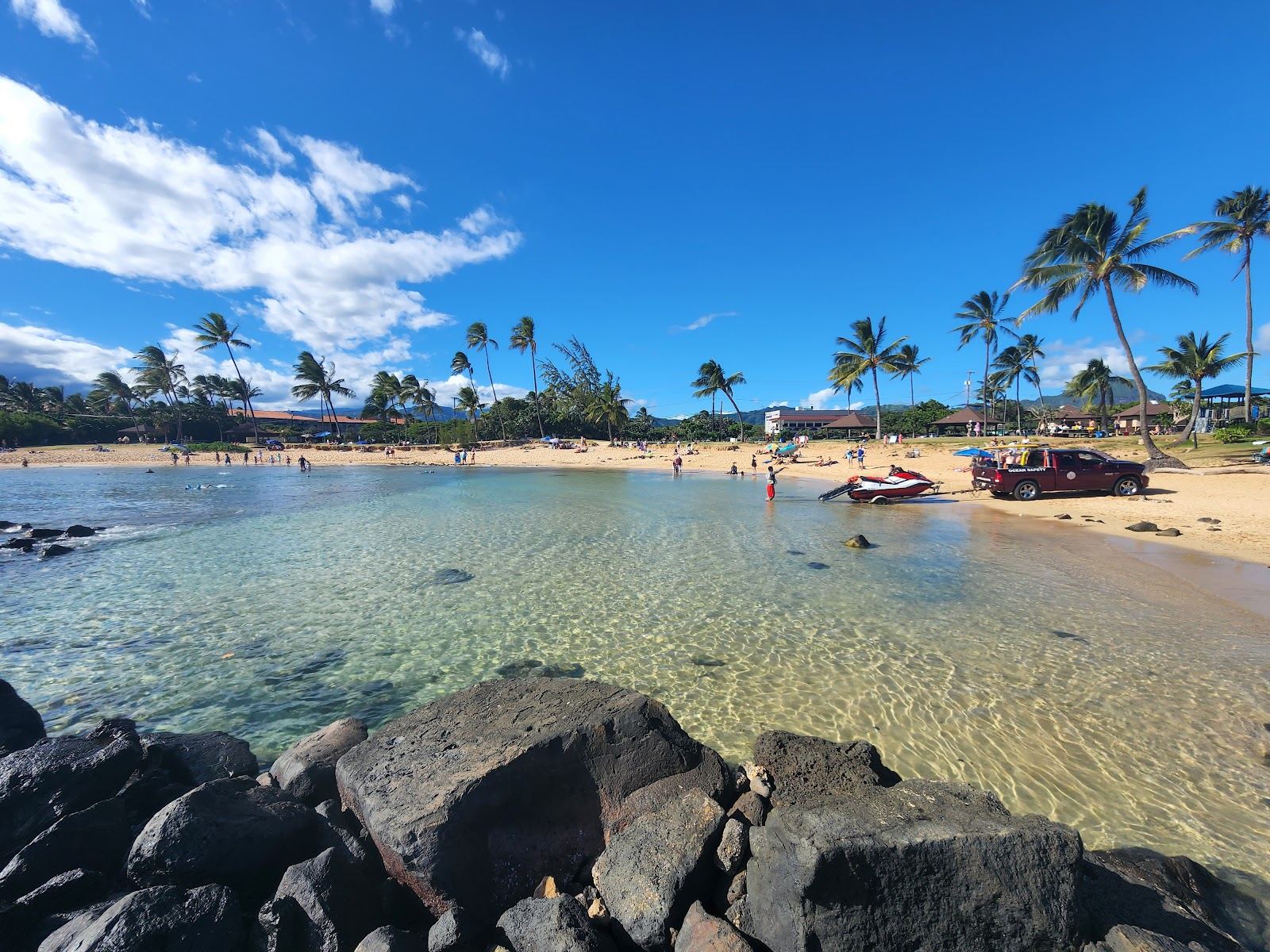 The golden sand and turquoise water of Poipu Beach Park on the south shore of Kauai