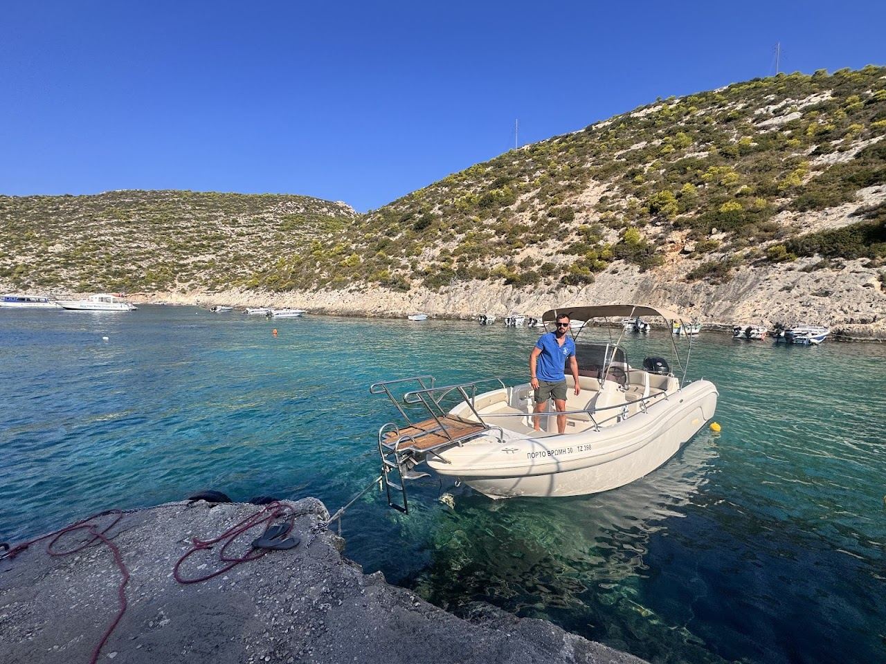 Turquoise water over a pebble seabed in the sheltered cove of Porto Vromi on the west coast of Zakynthos