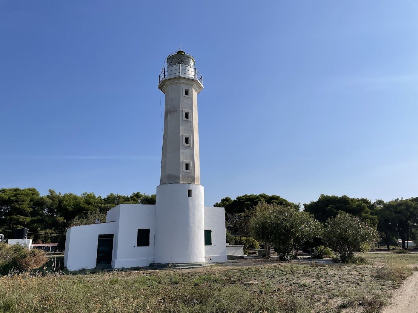 Lighthouse and pale sand cape reaching into the sea at Possidi on Kassandra in Halkidiki
