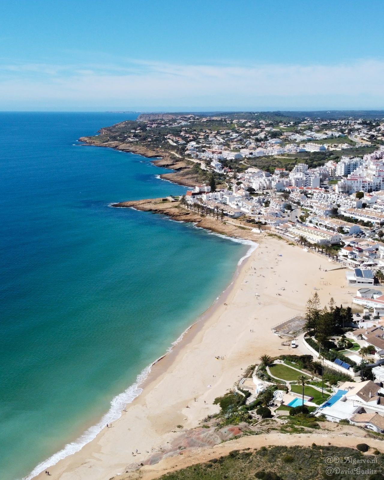 Praia da Luz sandy bay and the Rocha Negra headland near Lagos