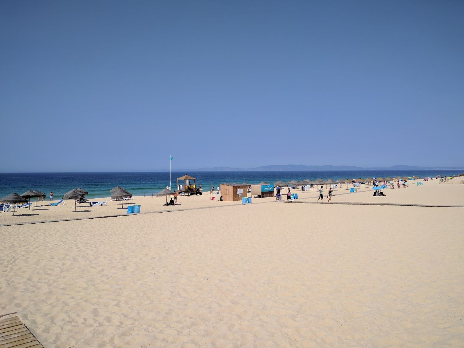 Wide golden Atlantic sand backed by dunes at Praia do Carvalhal in Comporta