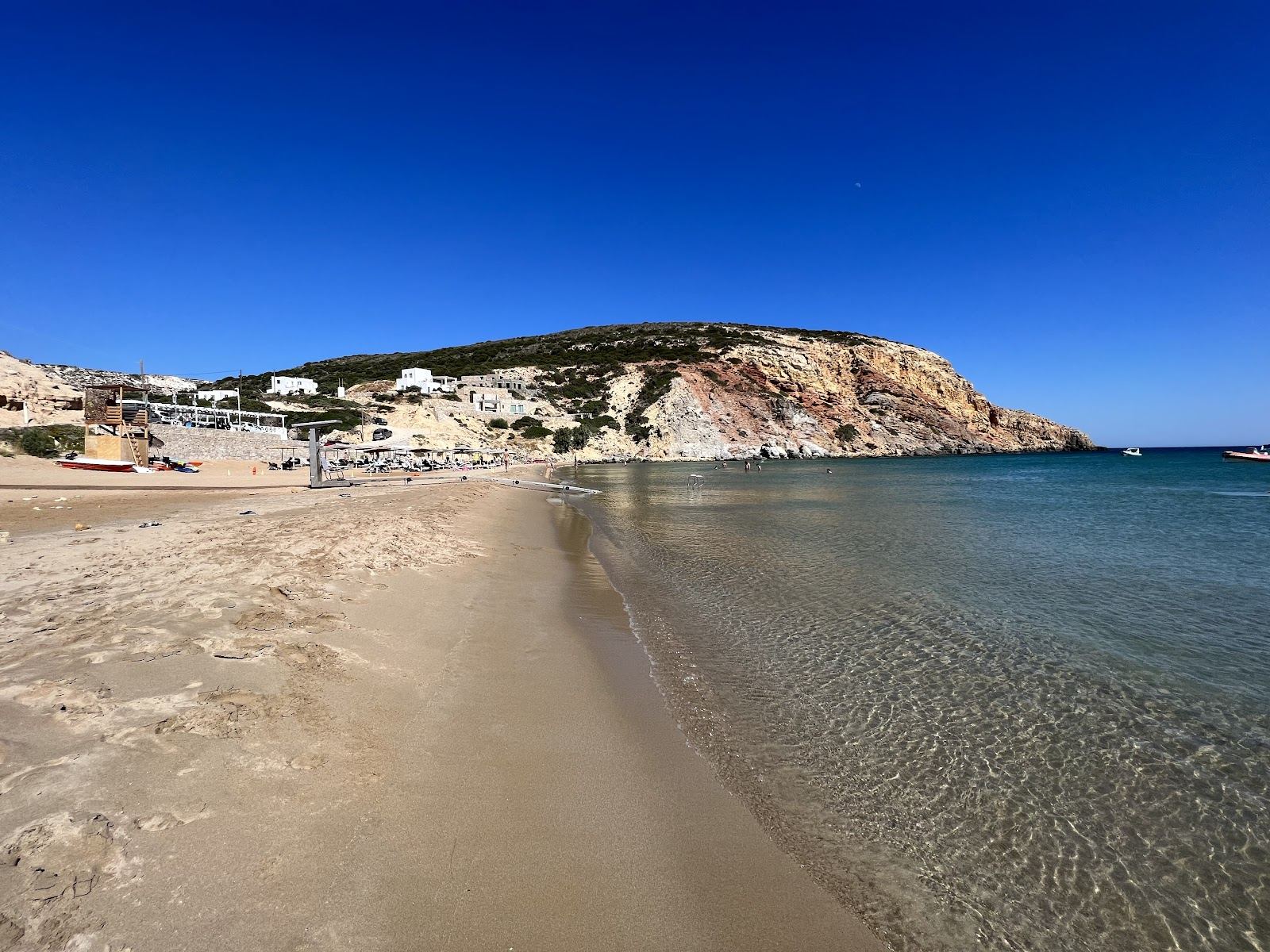 Soft golden sand and calm shallow water at Provatas beach on the south coast of Milos