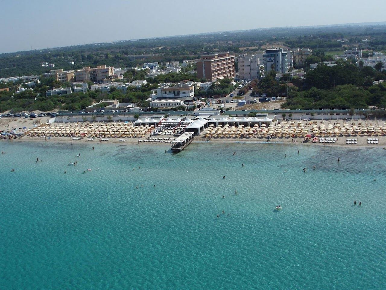 The sandy beach and lidos of Baia Verde near Gallipoli in Salento, Puglia