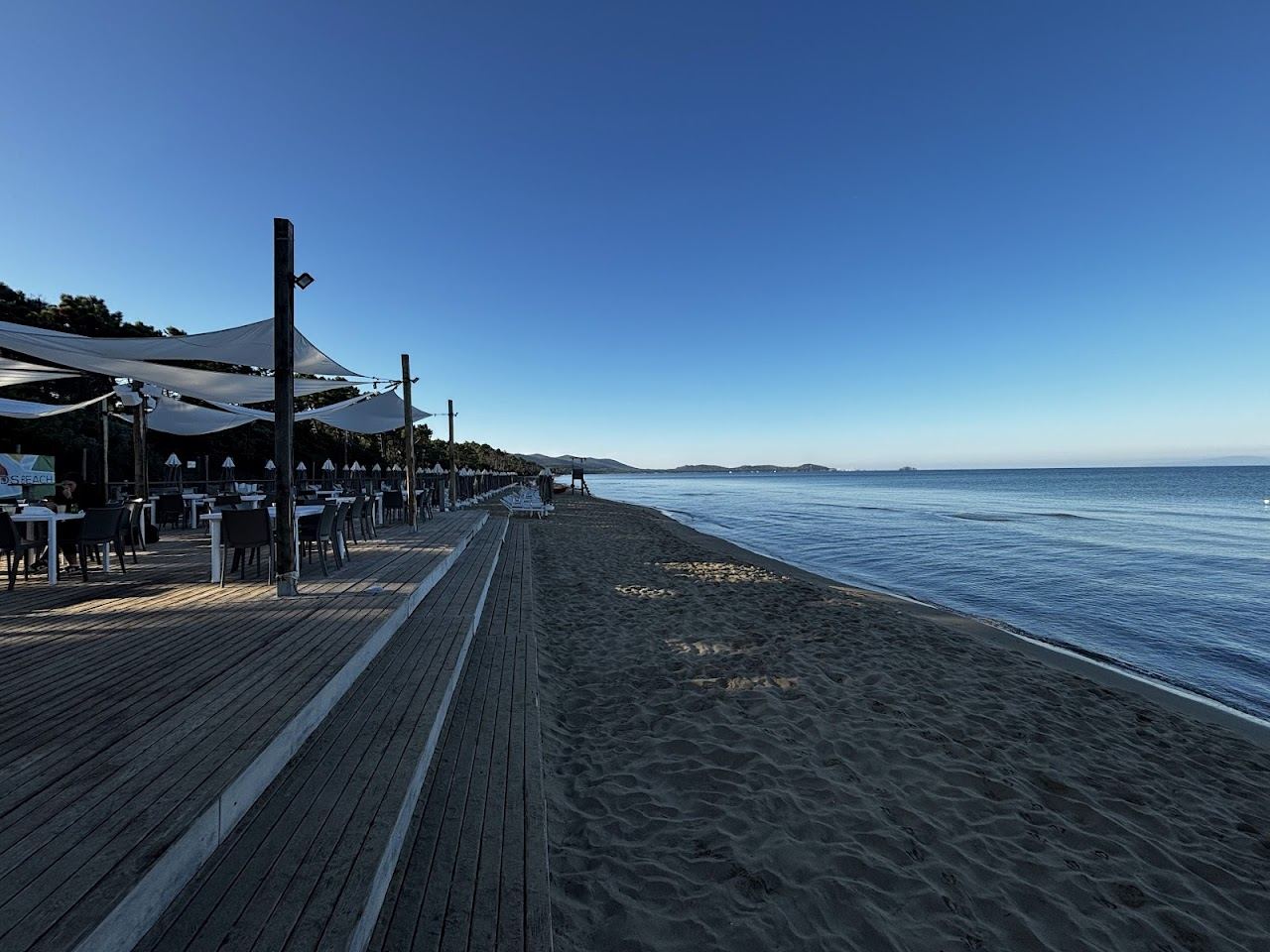 The pine backed golden sand of the Punta Ala bay on the Maremma coast