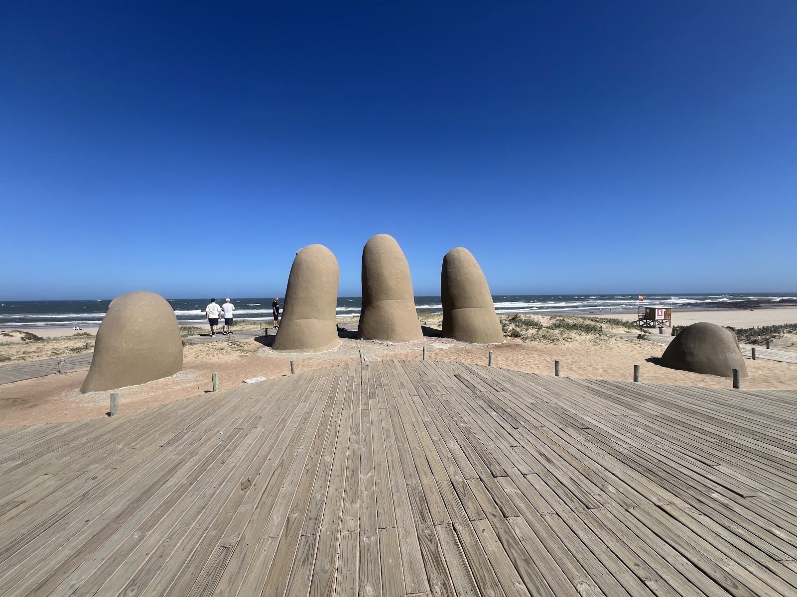 Playa de los Dedos Punta del Este with the Hand sculpture rising from the sand