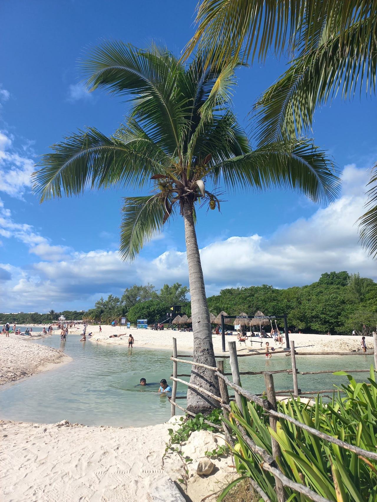 Soft white sand, calm sea and the freshwater cenote channel at Punta Esmeralda in Playa del Carmen