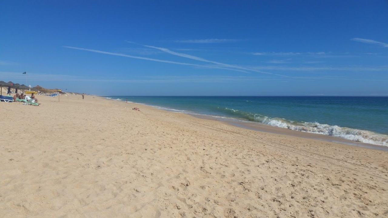 Praia da Quinta do Lago sand reached by a long wooden bridge over the lagoon