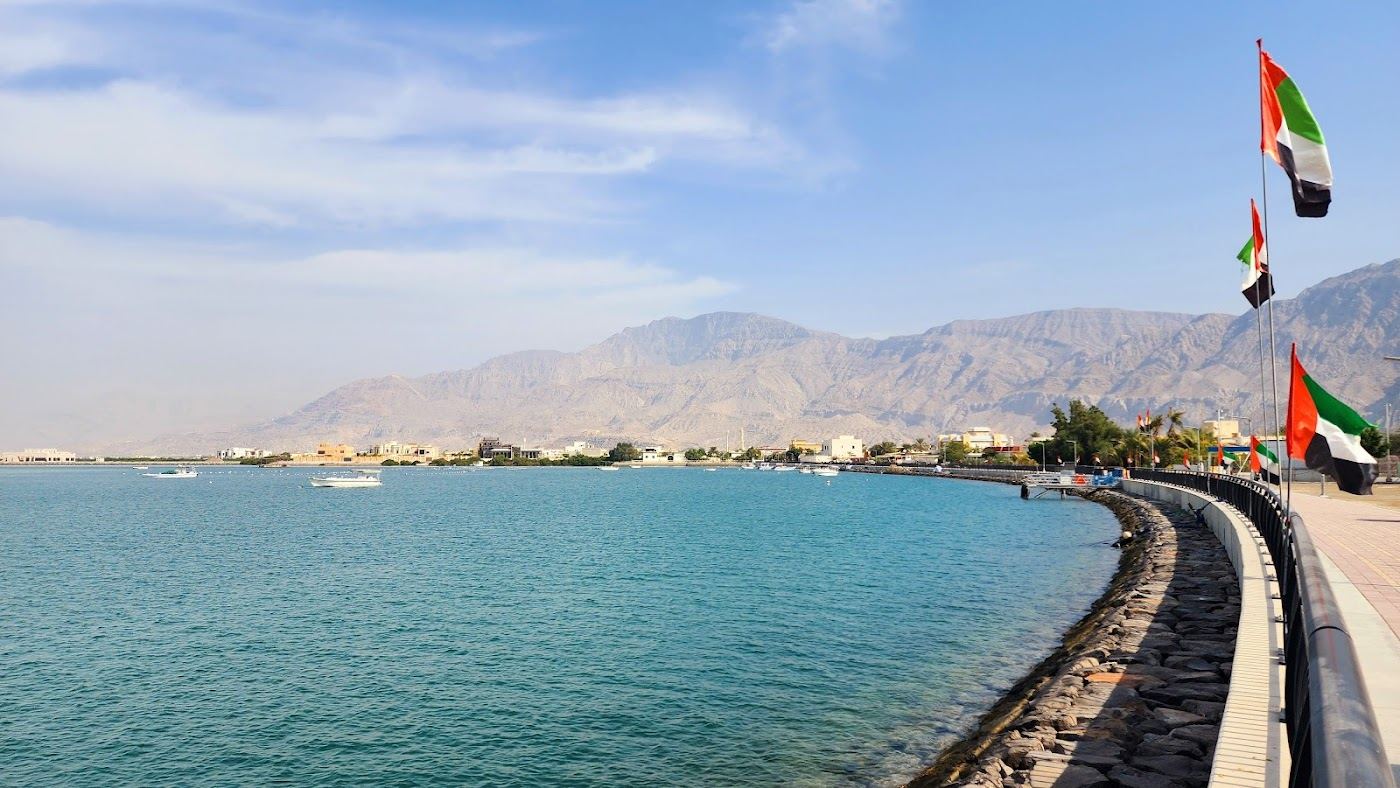 Quiet shoreline with palm groves and calm Gulf water at Rams in northern Ras Al Khaimah
