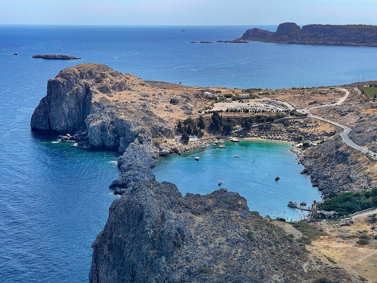 The near enclosed lagoon of Saint Pauls Bay below Lindos on Rhodes