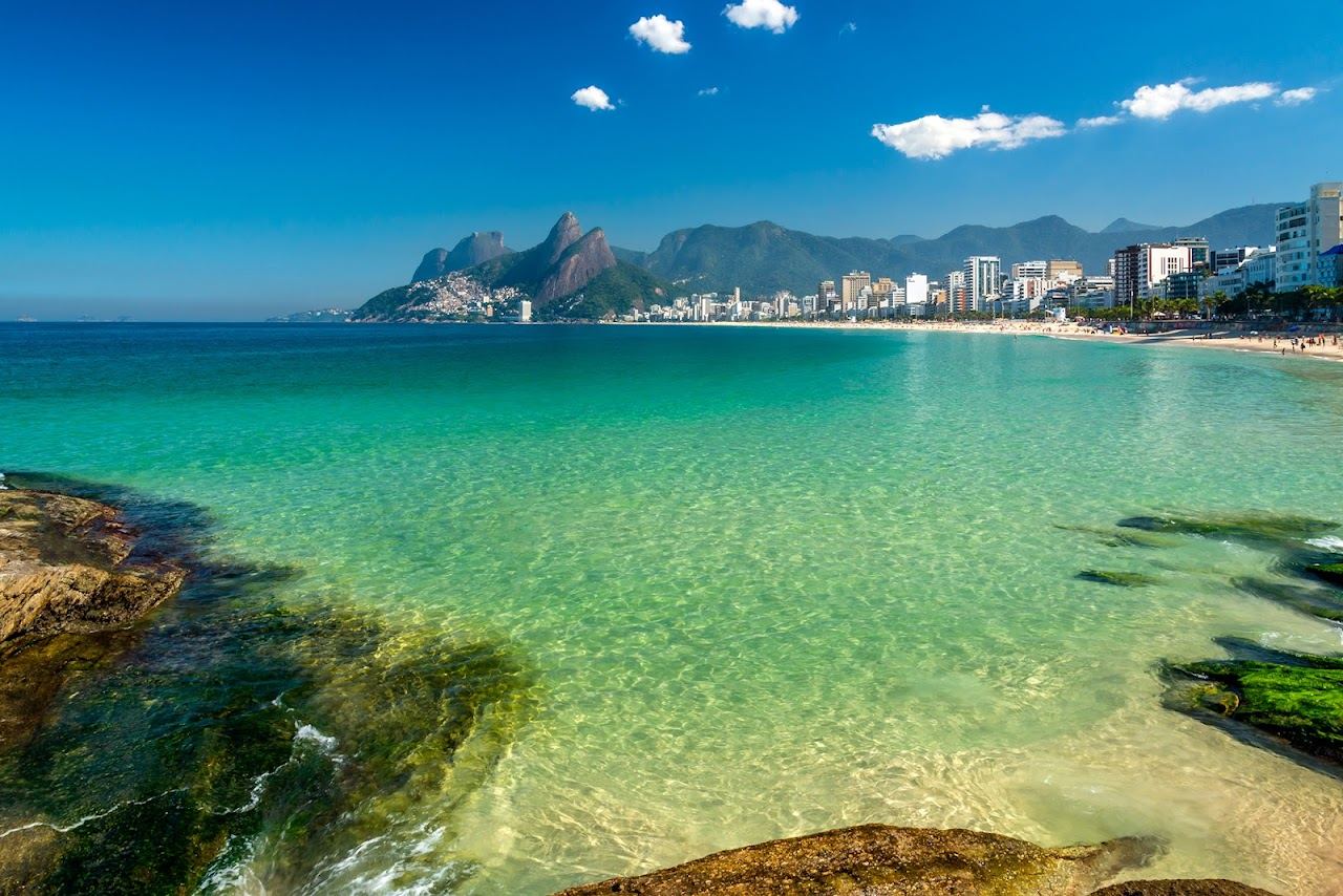 Golden evening light over the rock and surf at Arpoador between Ipanema and Copacabana in Rio de Janeiro