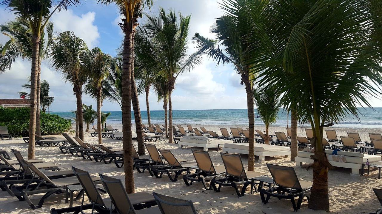 Calm turquoise shallows and pale sand on the Riviera Maya coast in Mexico