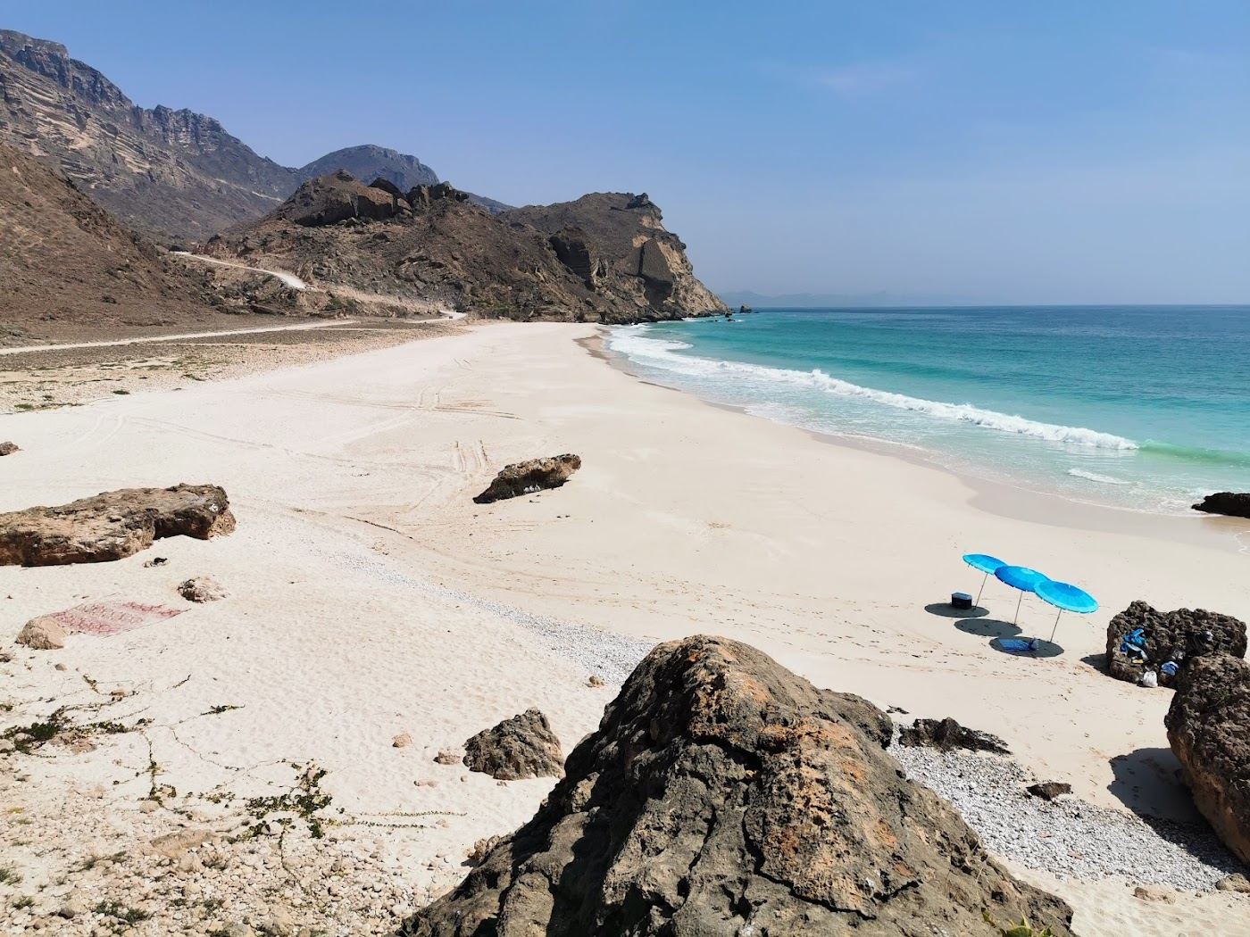 The dramatic cliffs and sand at Fazayah Beach near Salalah