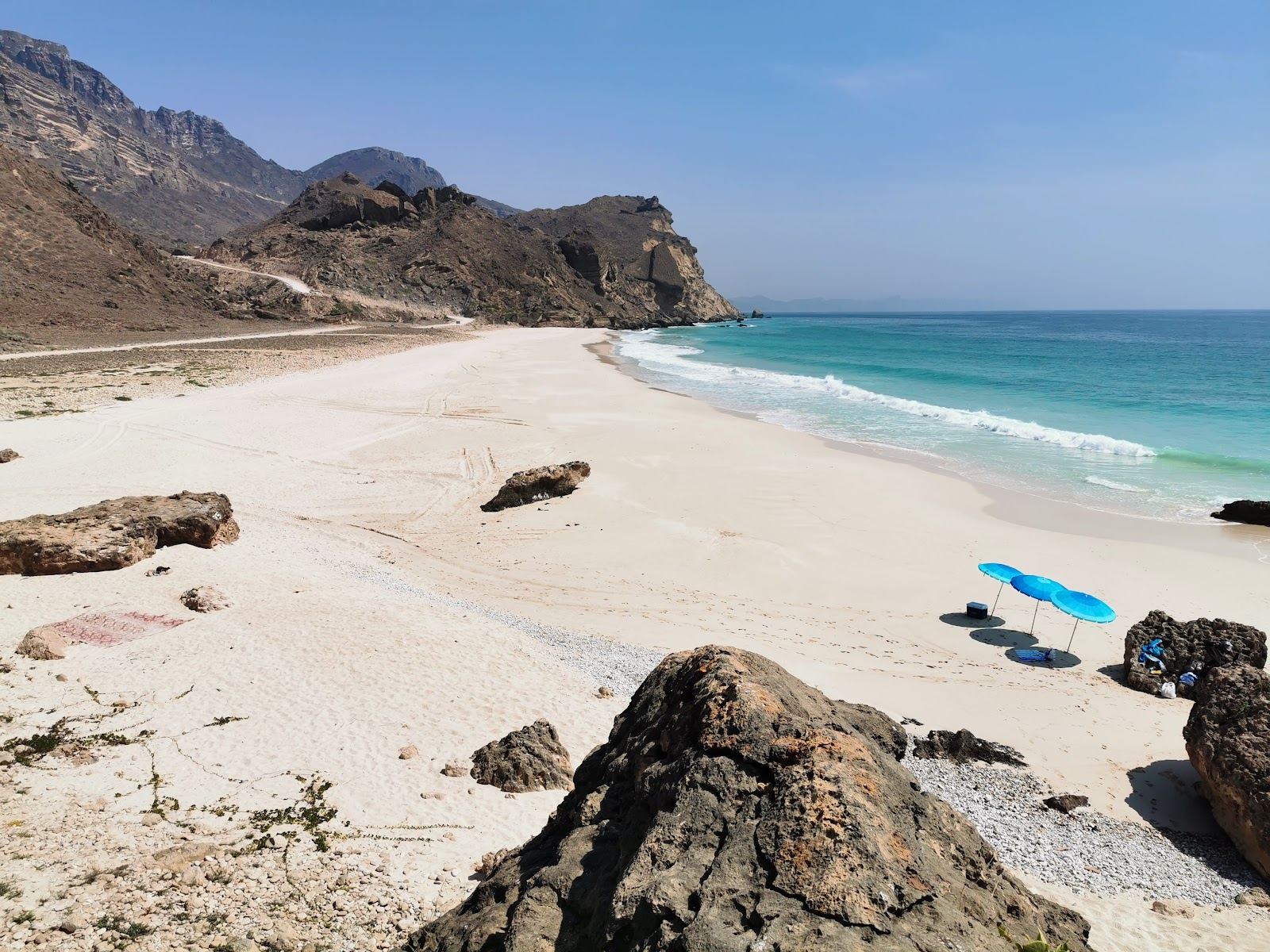 A quiet cove backed by dramatic cliffs at Fazayah near Salalah used for the secluded beaches guide on Beaches for Kings