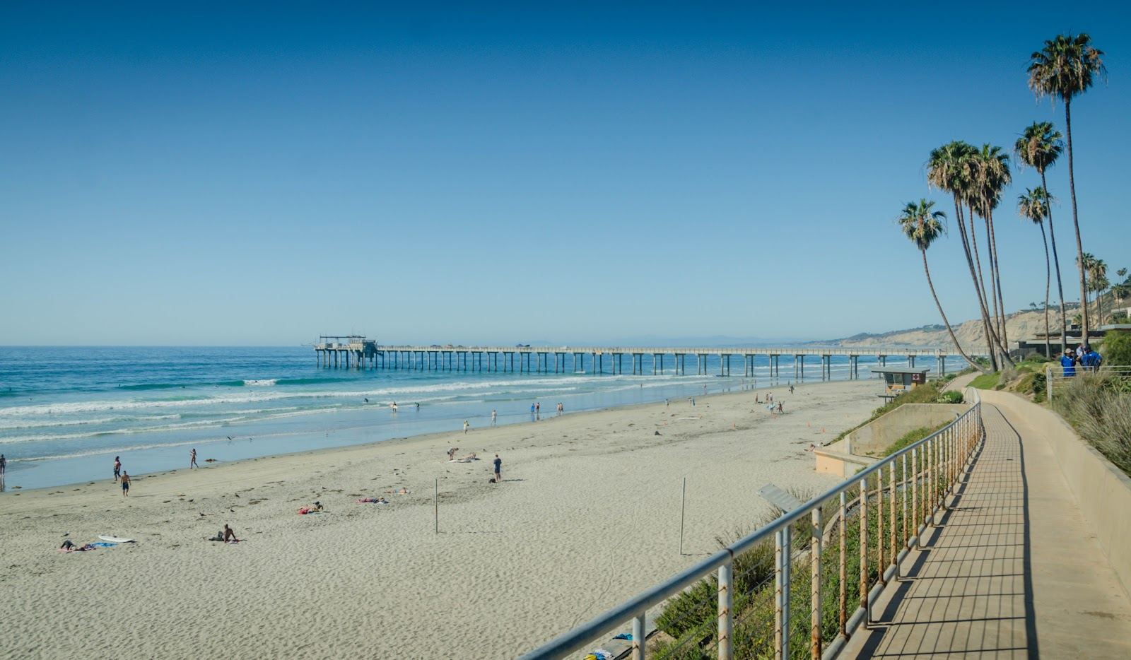 Calm clear water and a gentle slope of sand at a sheltered San Diego swimming beach
