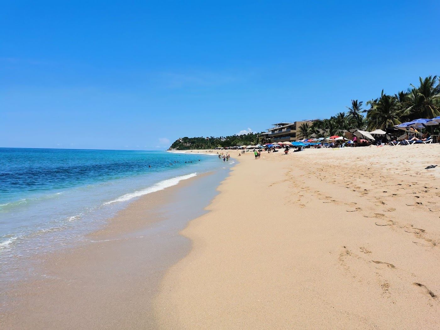 The wide golden sand and surf of San Pancho Beach on the Riviera Nayarit