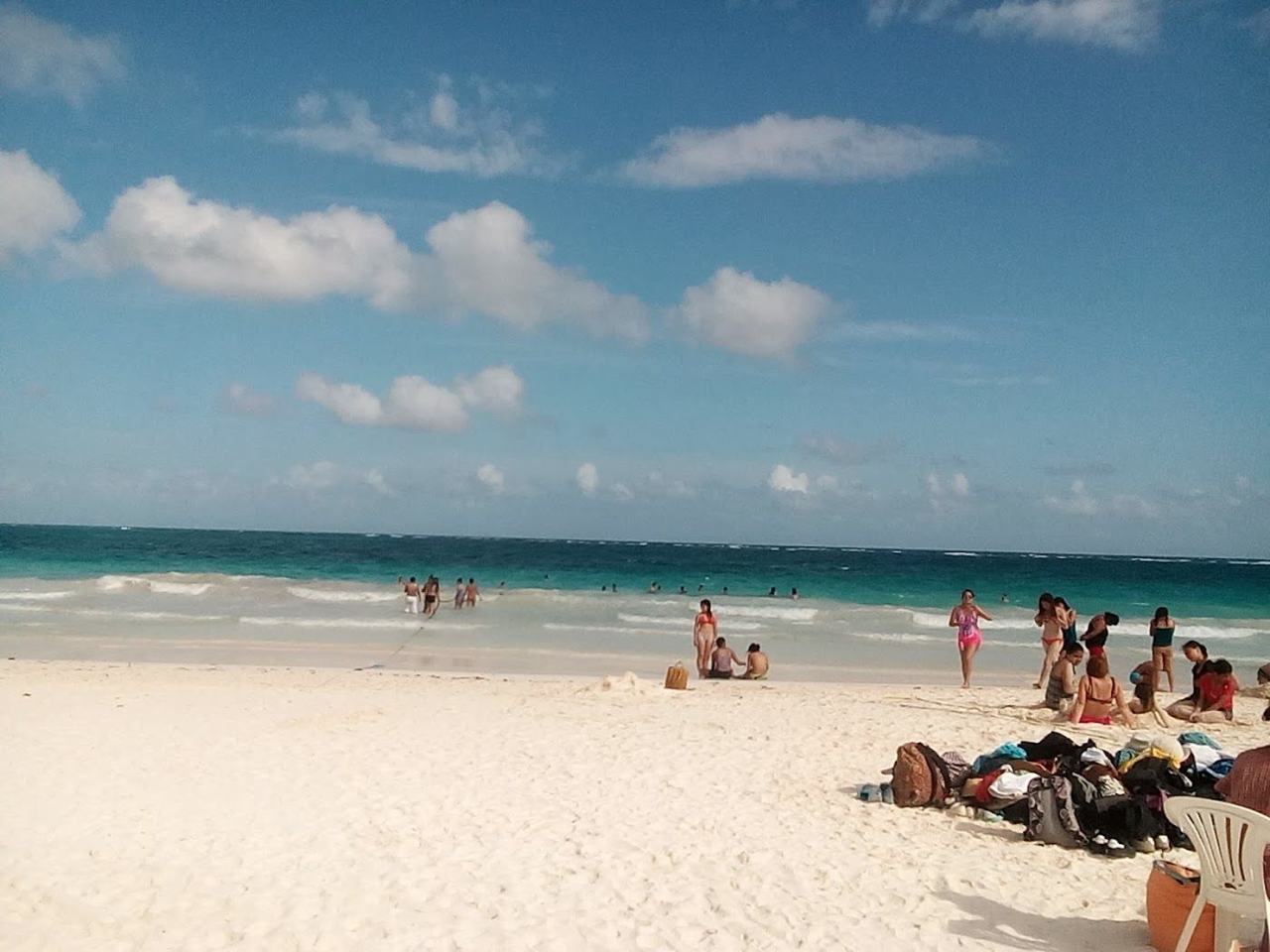 Open white sand and turquoise water at the free public beach of Playa Santa Fe in Tulum