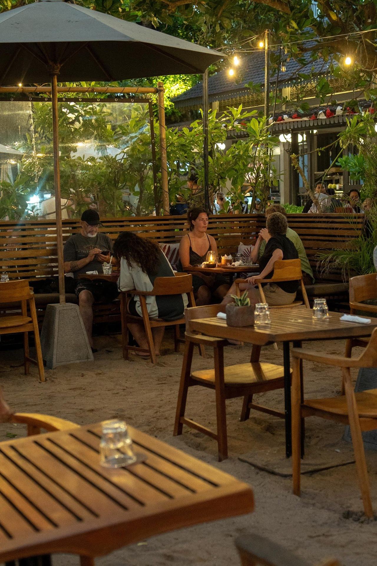 Beachfront tables and loungers at Soul on the Beach in Sanur Bali
