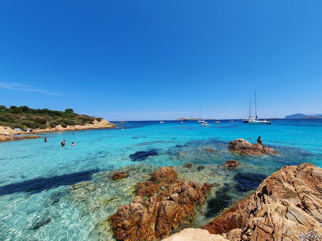 Sheltered turquoise water and granite rocks at Spiaggia del Principe on the Costa Smeralda, Sardinia
