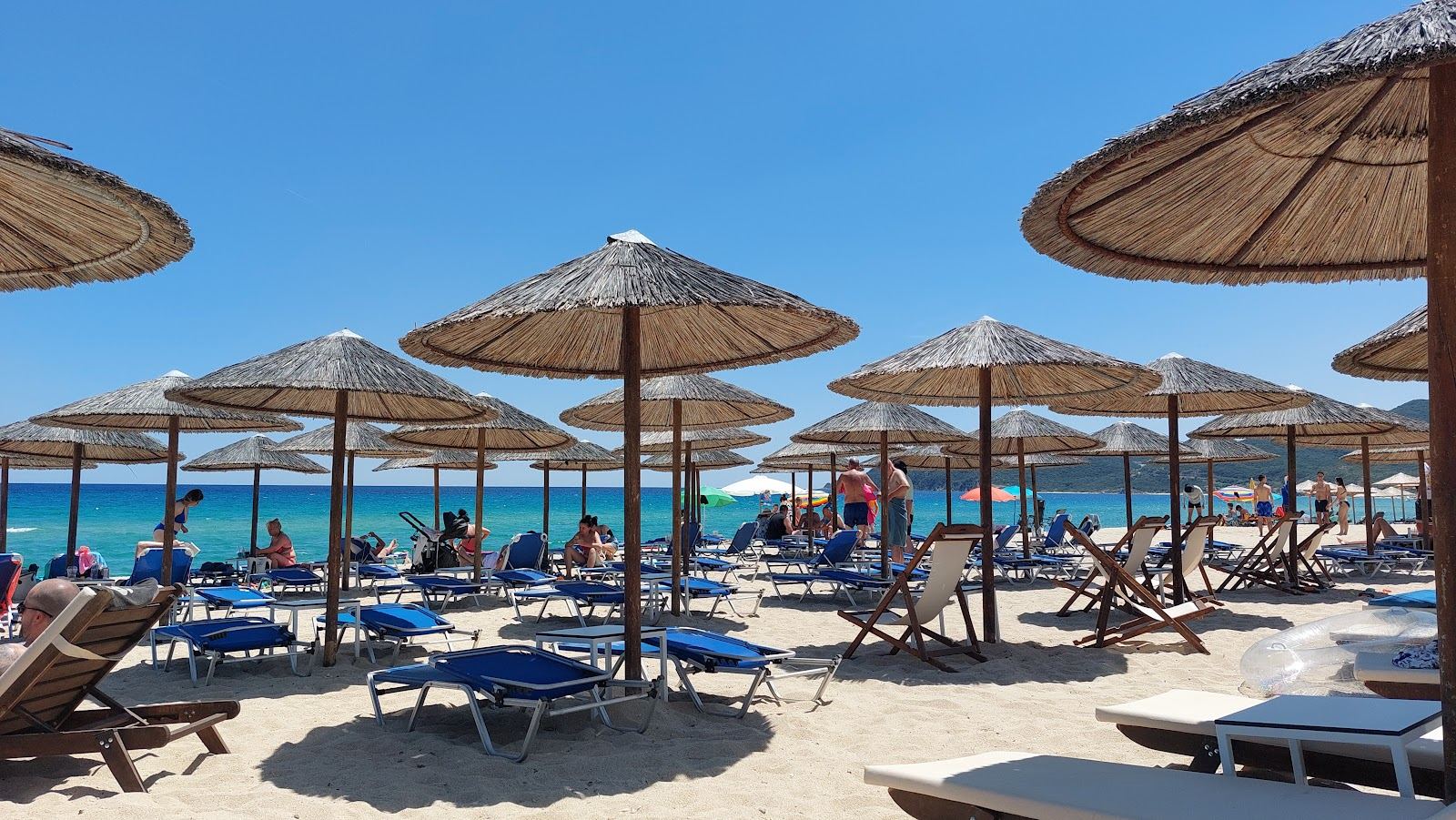 Long sandy beach with the Mount Athos view at Sarti on the east coast of Sithonia