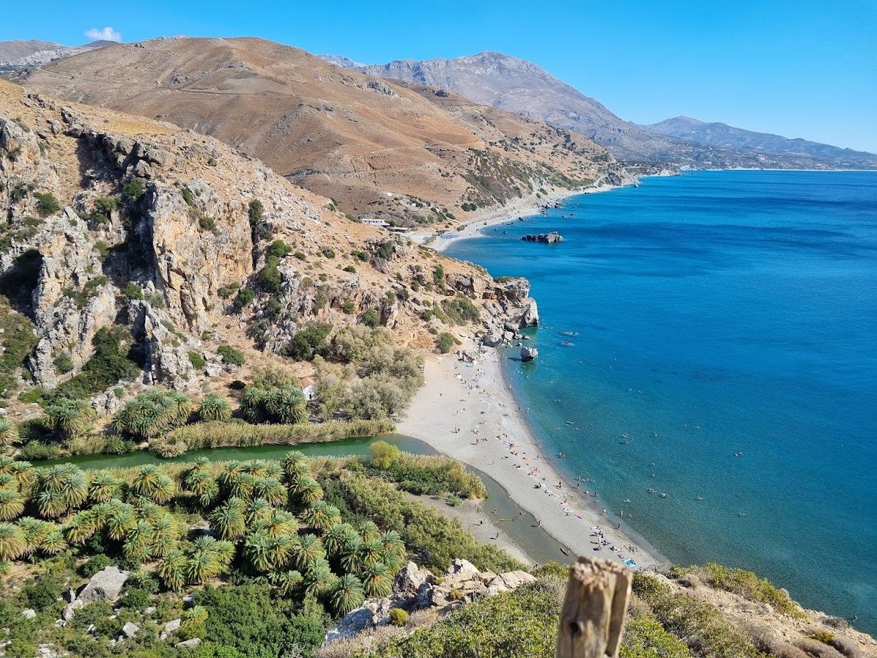 The palm lined river meeting the sea at Preveli beach on southern Crete