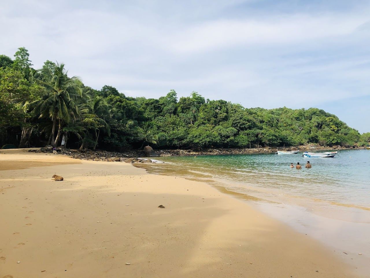 The small calm cove backed by jungle at Jungle Beach near Unawatuna in Sri Lanka