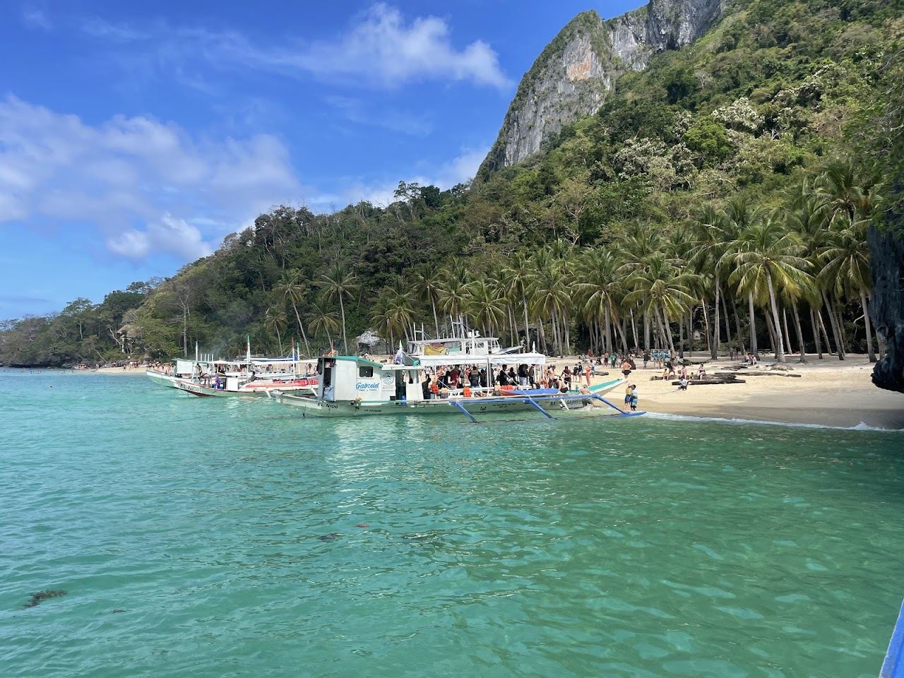 Seven Commandos Beach white sand and clear water in Bacuit Bay near El Nido