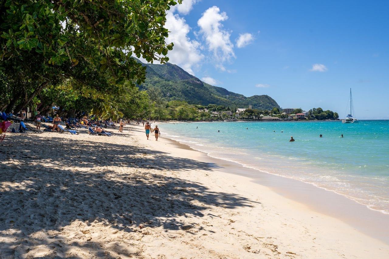 Turquoise water and granite boulders at Beau Vallon beach on Mahe in the Seychelles