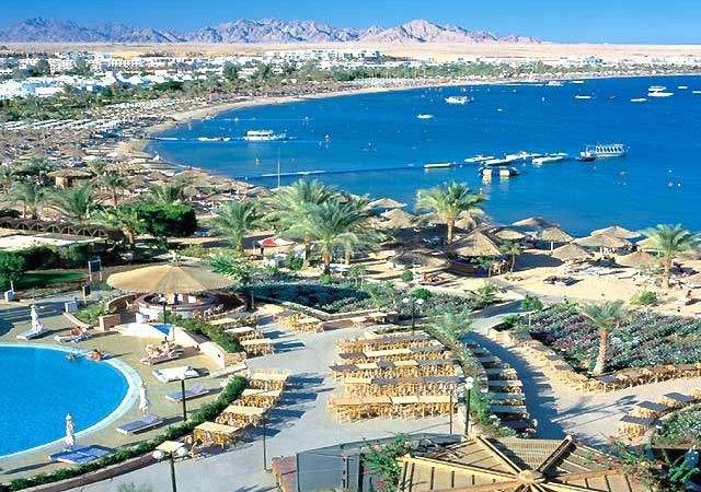 The sheltered sandy curve of Naama Bay in Sharm El Sheikh backed by hotels on the Red Sea in Egypt