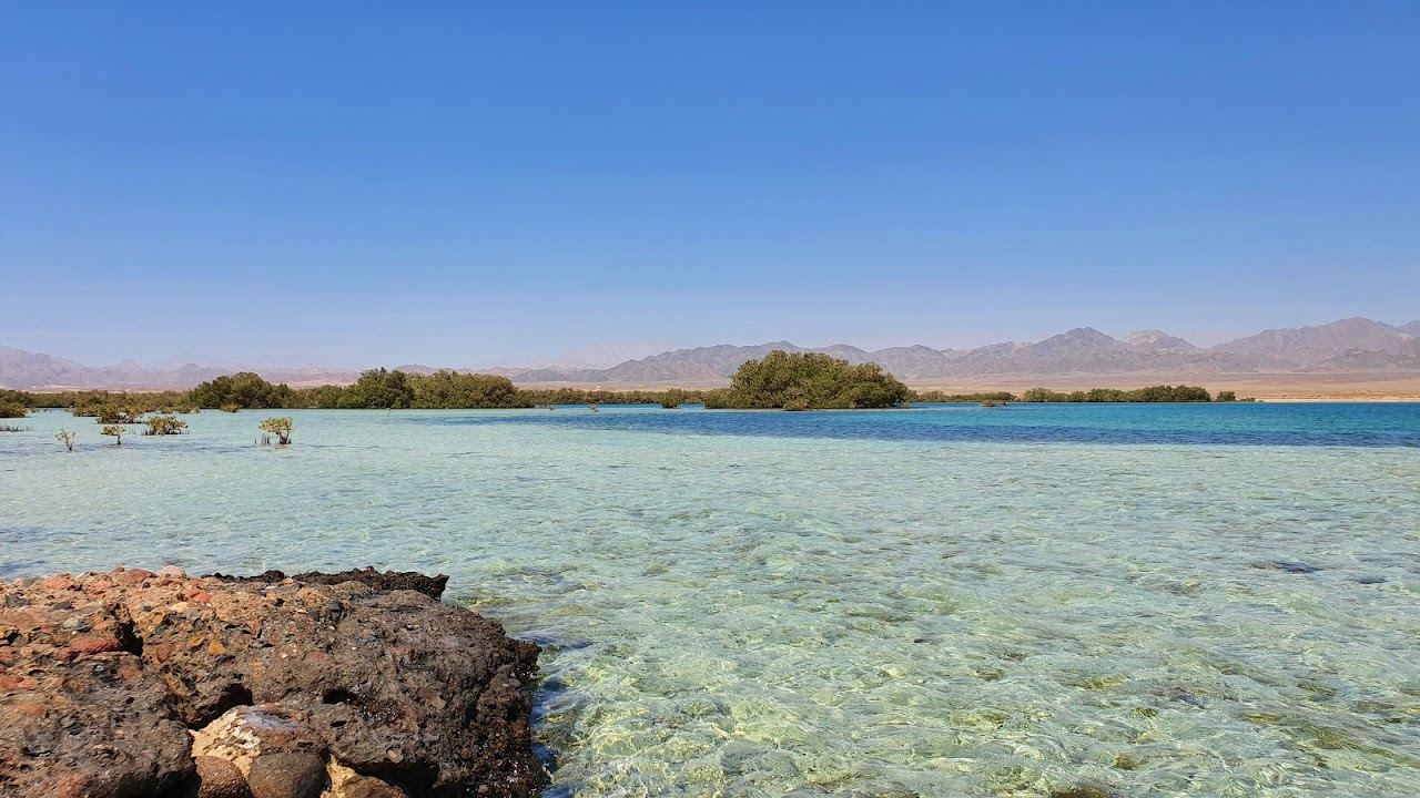 The wide resort shore and shallow water at Nabq Bay near the airport in Sharm El Sheikh in Egypt