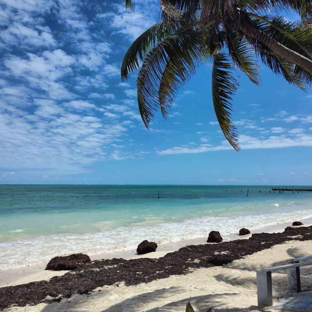 Clear shallow water over pale sand on an empty beach in the Sian Kaan reserve near Punta Allen