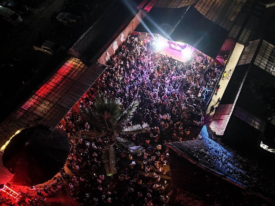 Beachfront stage and bar at Siargao Beach Club in General Luna at night