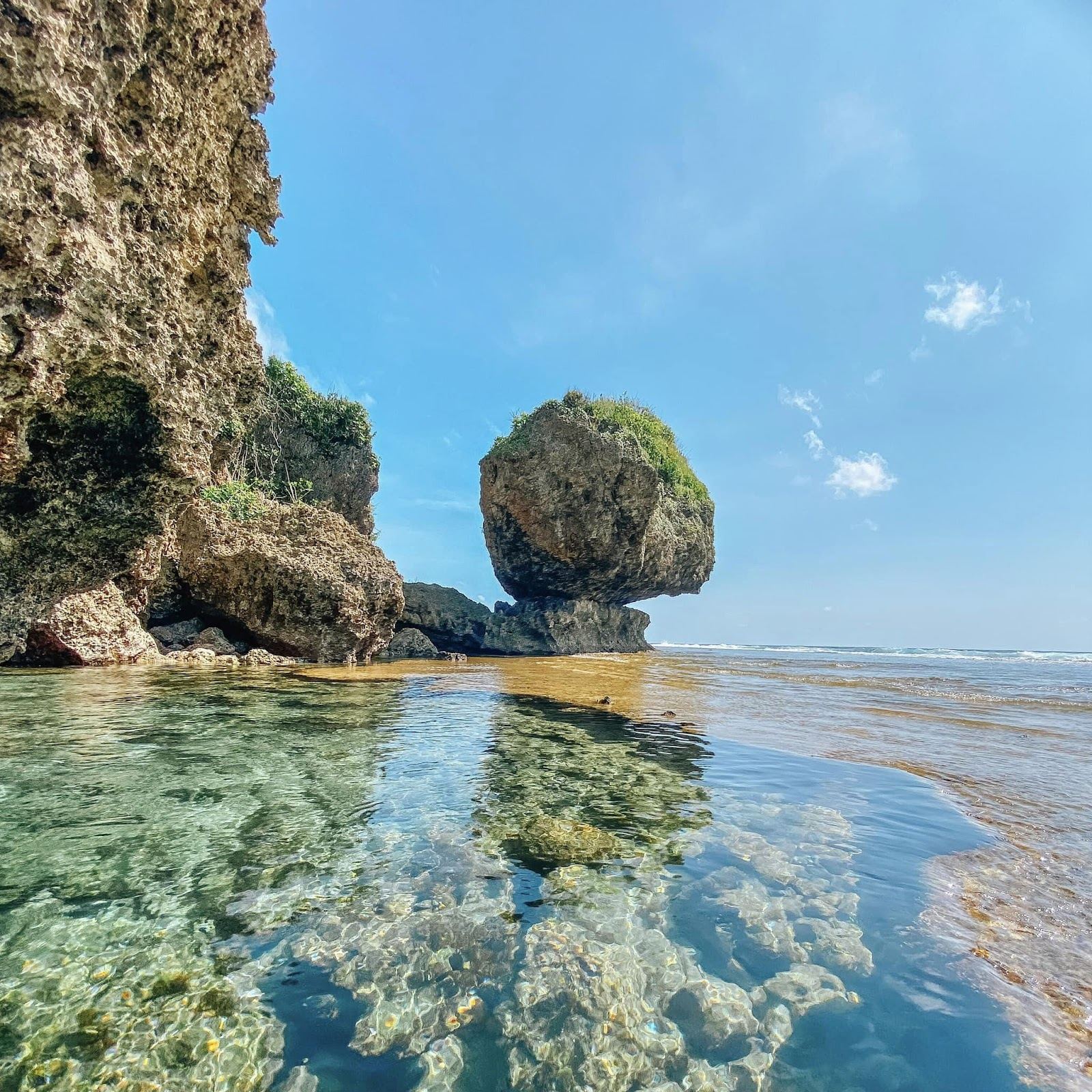 The natural tidal rock pool at Magpupungko on Siargao, calm and shallow at low tide