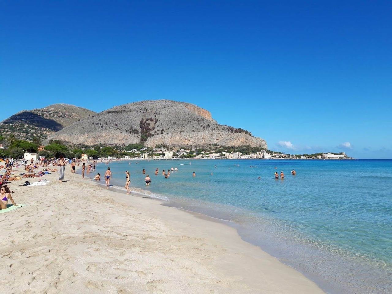 Daybeds and sunbeds at a beach club in Sicily