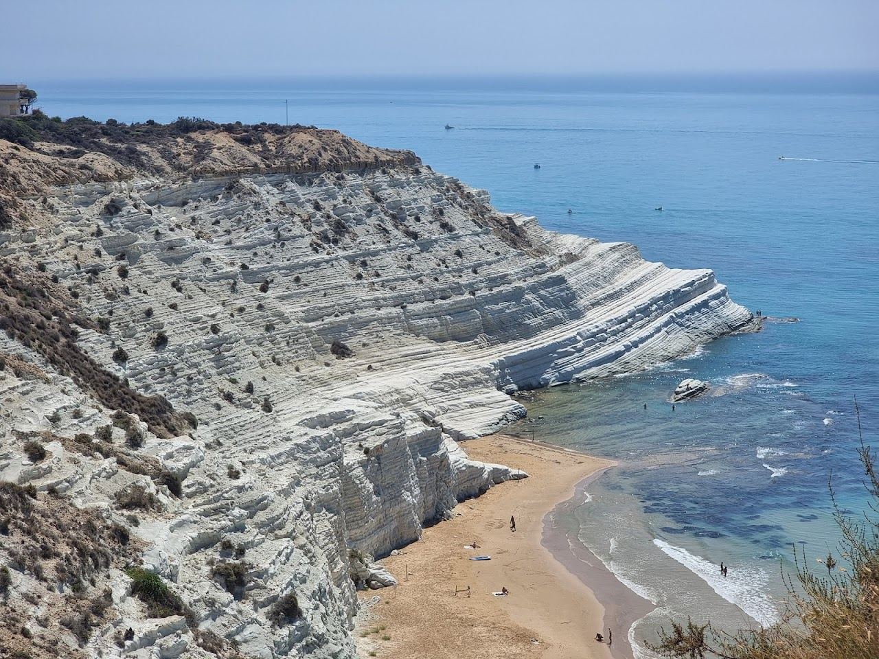 Evening light on the white stepped marl cliff of Scala dei Turchi above the sea near Realmonte in Sicily