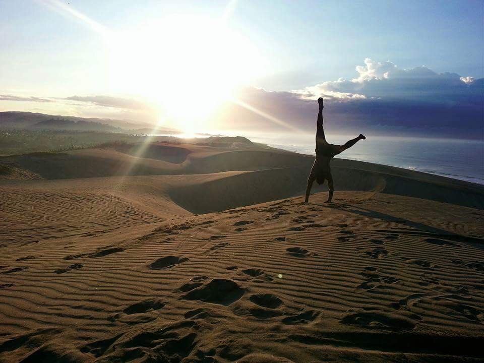 Rolling coastal sand dunes meeting the open surf at Sigatoka on the Coral Coast of Fiji