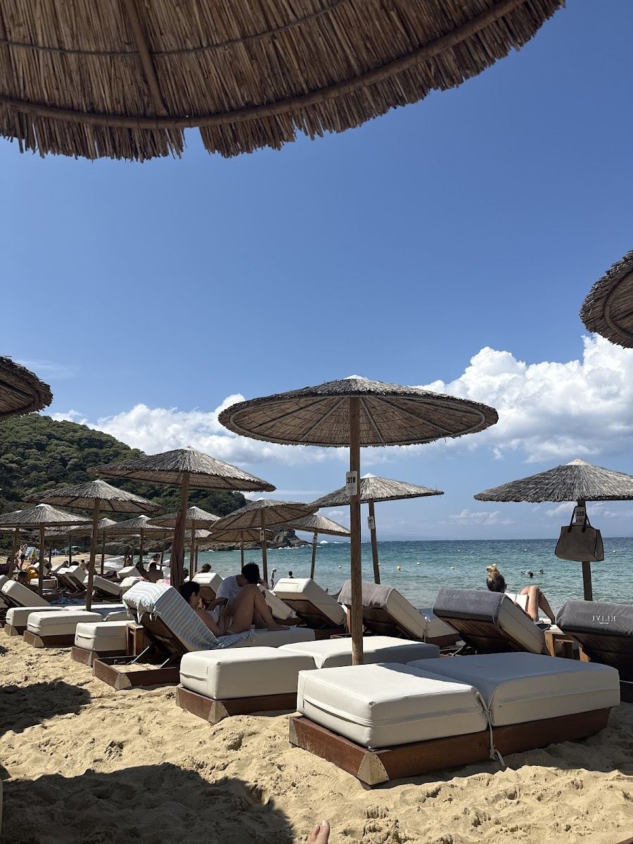 Sunbeds and umbrellas on the larger Banana Beach crescent next door to Little Banana