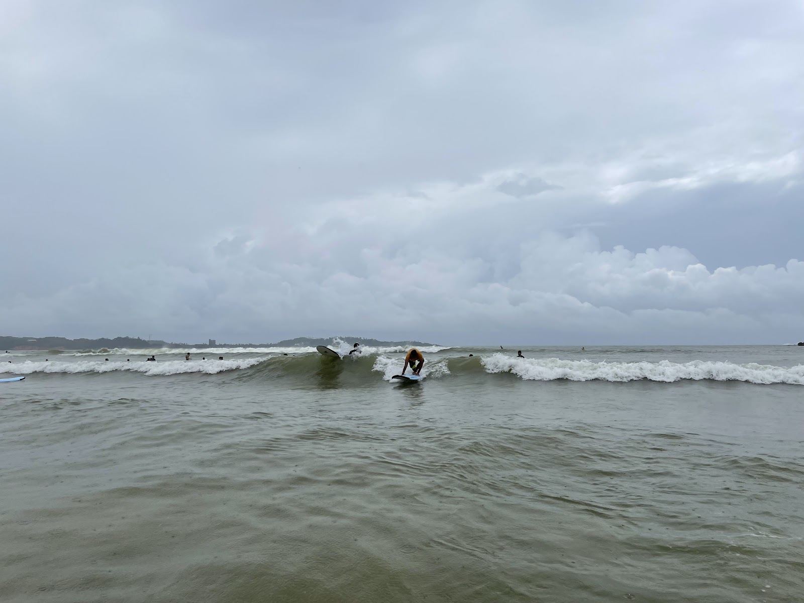 Wide palm backed surf bay at Weligama on the Sri Lanka south coast, a digital nomad base