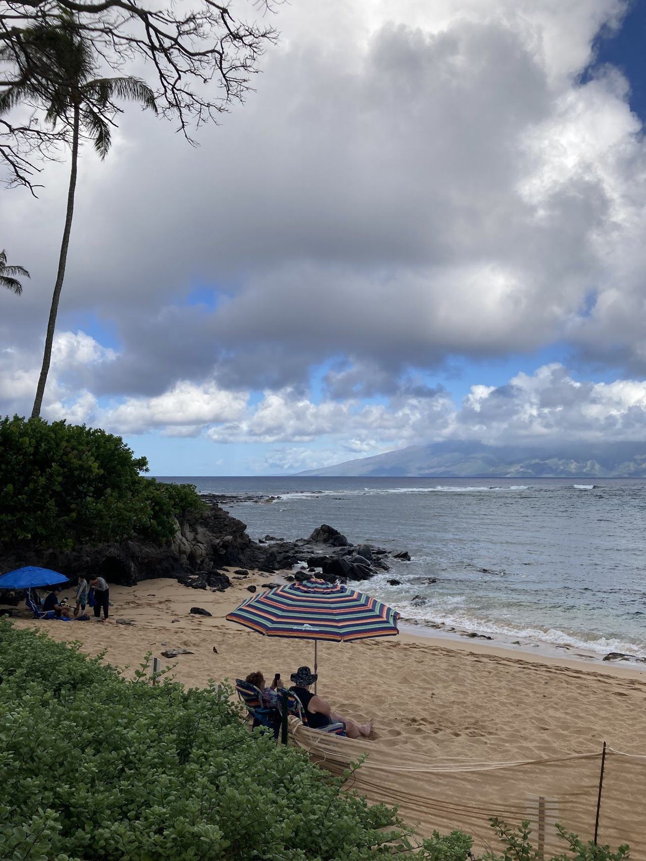 The sheltered crescent of Kapalua Bay on Maui with clear water over a reef close to shore