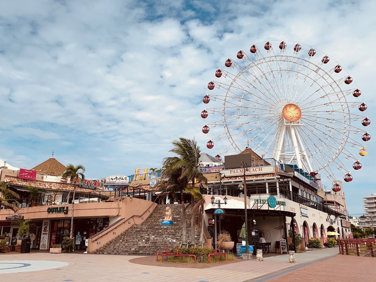 The shops and Ferris wheel of Mihama American Village beside Sunset Beach in Chatan, Okinawa