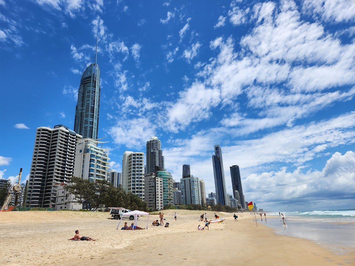 Long sandy beach and surfers at Surfers Paradise Gold Coast