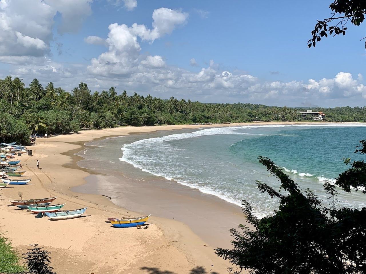 Talalla Beach long curving golden palm backed bay on the Sri Lanka south coast