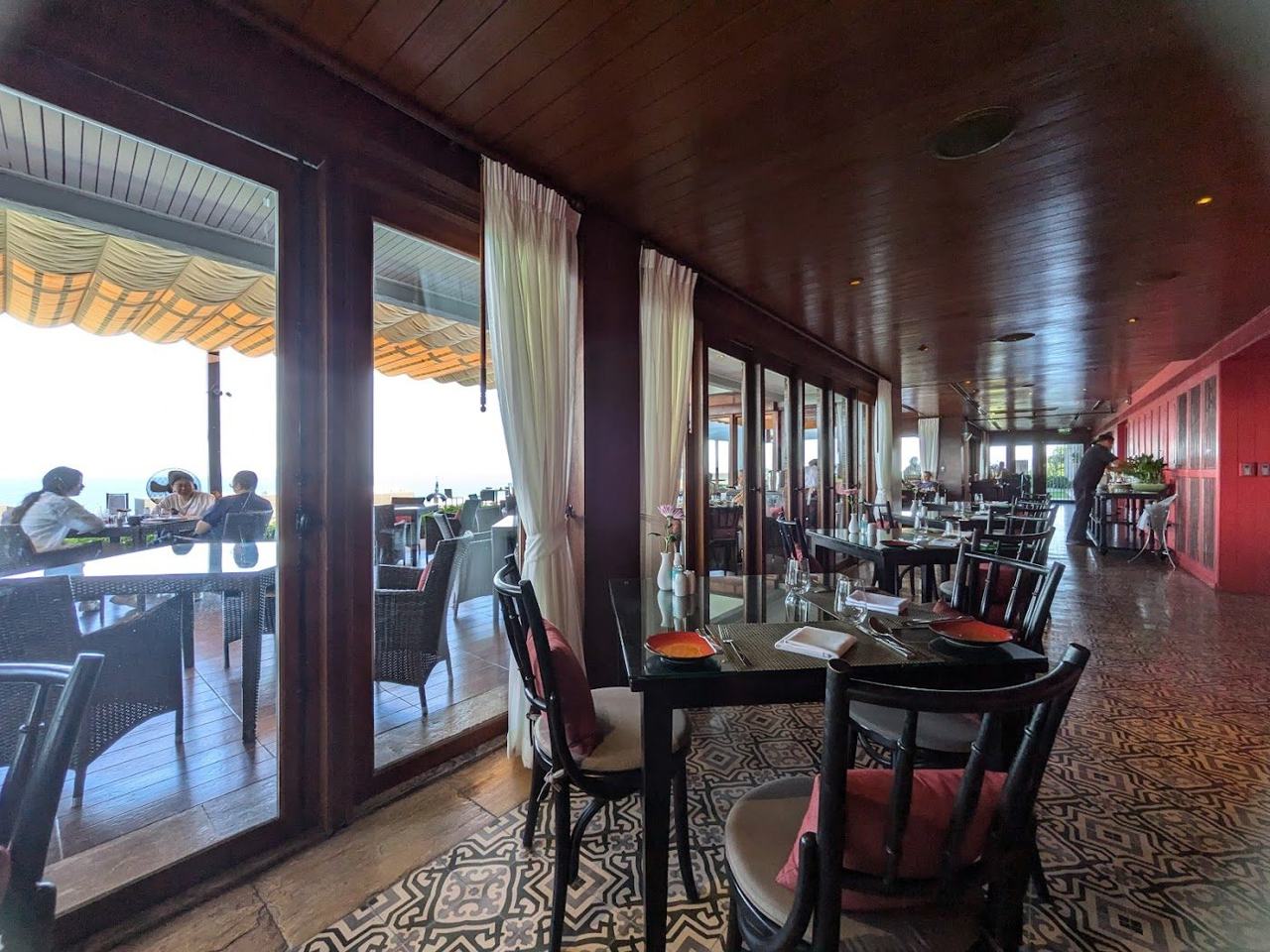 Clifftop sunset bar with infinity views over the bay at the InterContinental Koh Samui above Taling Ngam
