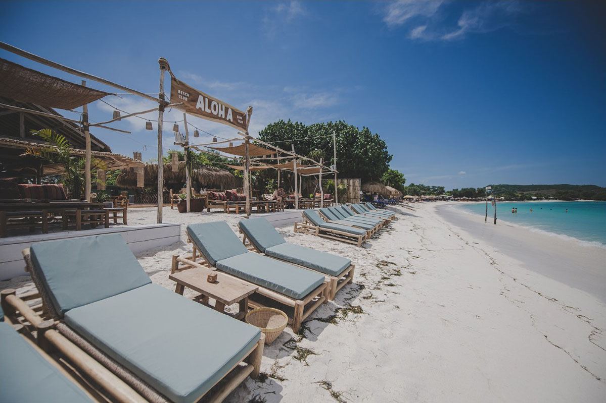 Beachfront daybeds at Aloha Beach Club on Tanjung Aan, the nearest club coast to Pink Beach in Lombok
