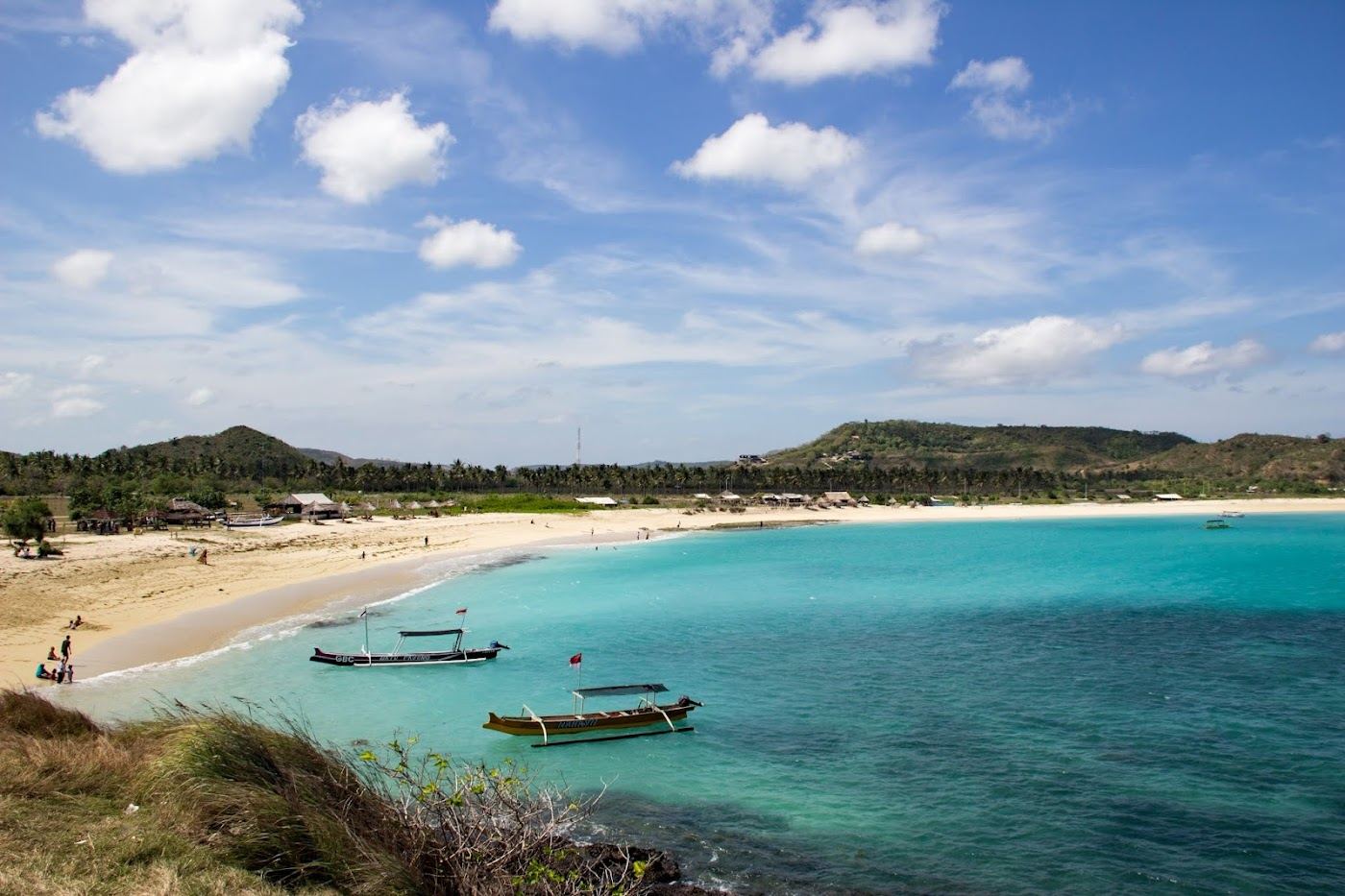Pale peppercorn sand and turquoise water at Tanjung Aan in Lombok