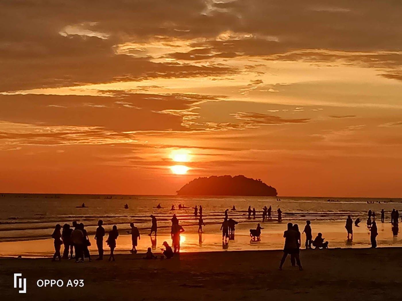 The quiet local sand and calm sea at Tanjung Aru Beach in Penang
