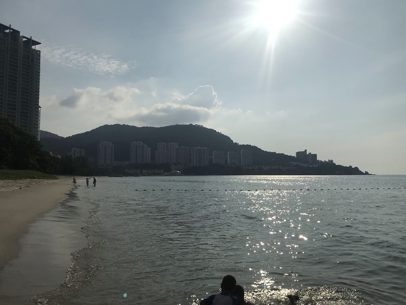 The local sand and sea at Tanjung Bungah Beach in Penang